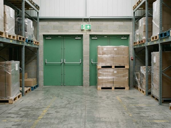 A photograph of a warehouse shelf with a typed question above it.